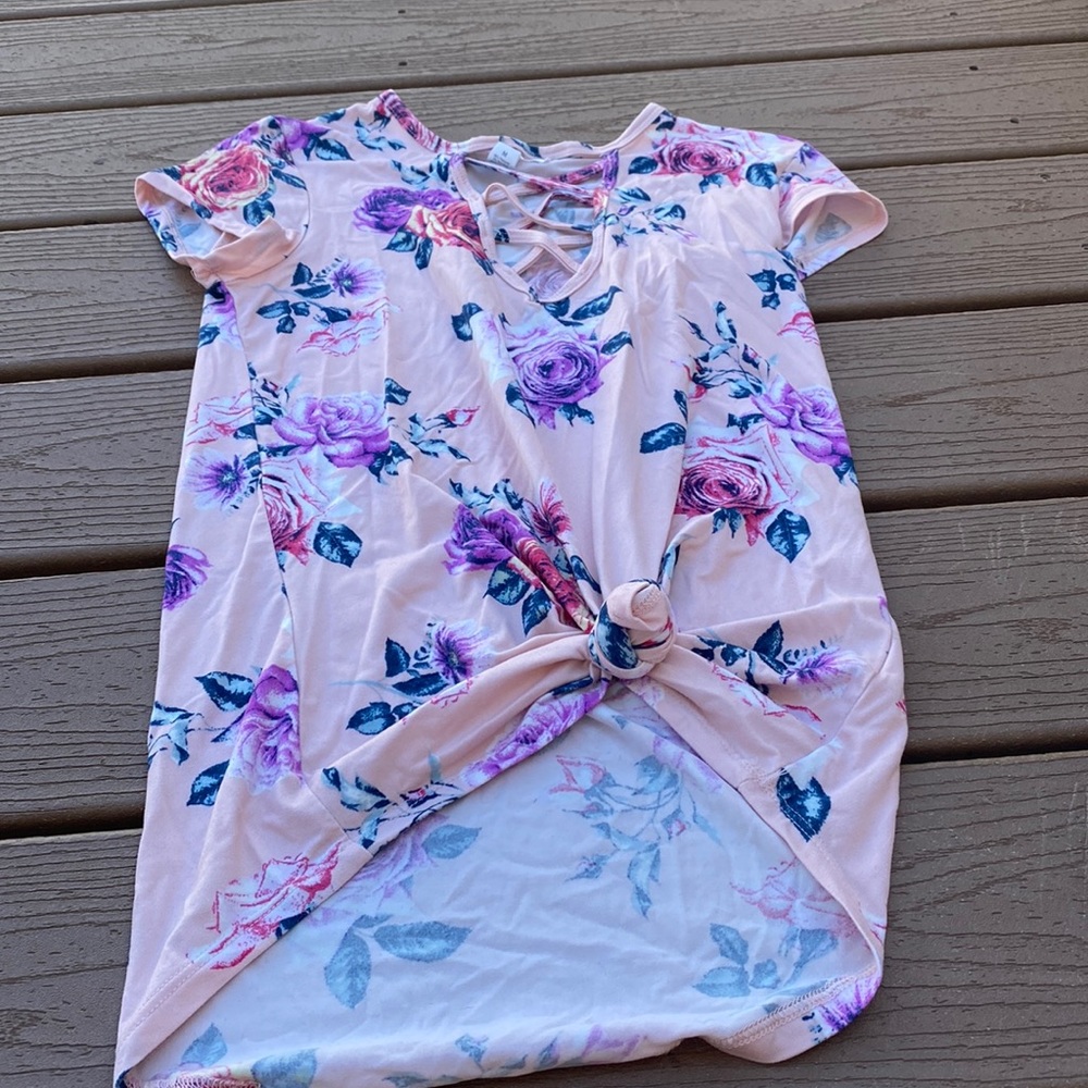 Rose shirt that opens down the middle.